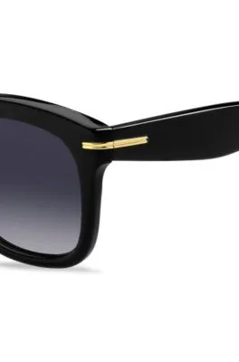 Gafas de sol de acetato negro con bisagras en tono dorado