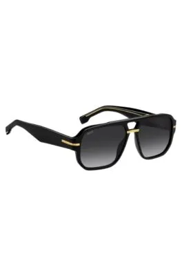 Gafas de sol de acetato negro con detalles en tono dorado 