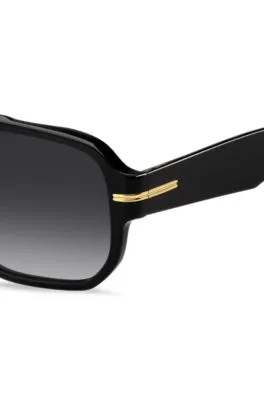 Gafas de sol de acetato negro con detalles en tono dorado 