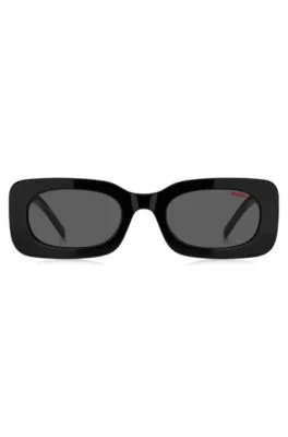 Gafas de sol de acetato negro con eslóganes en la correa desmontable